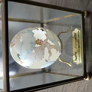 Carved Angels Egg in Display Case.